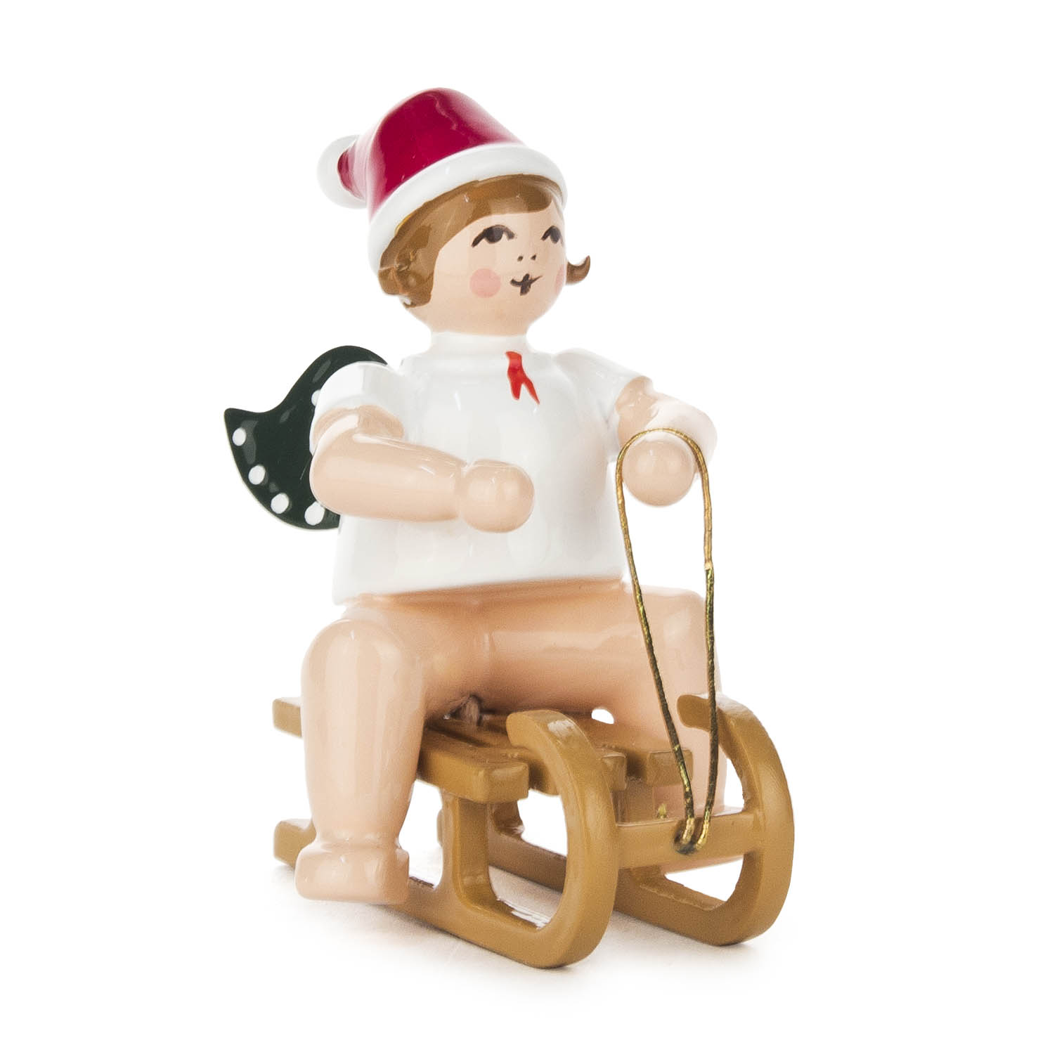 Wooden angel figurine wearing a red Santa hat, sitting on a sled, holding a gold string as reins. im Dregeno Online Shop günstig kaufen
