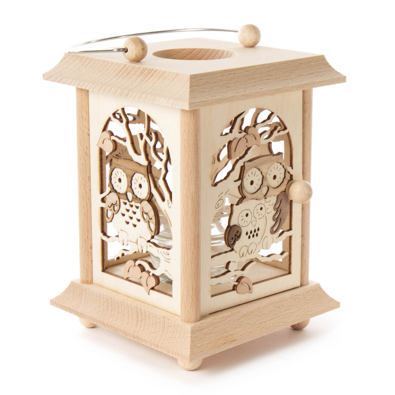 A wooden table lantern featuring an owl design, with cut-out panels showing owls and trees. It has a glass insert for a tea light or votive candle.