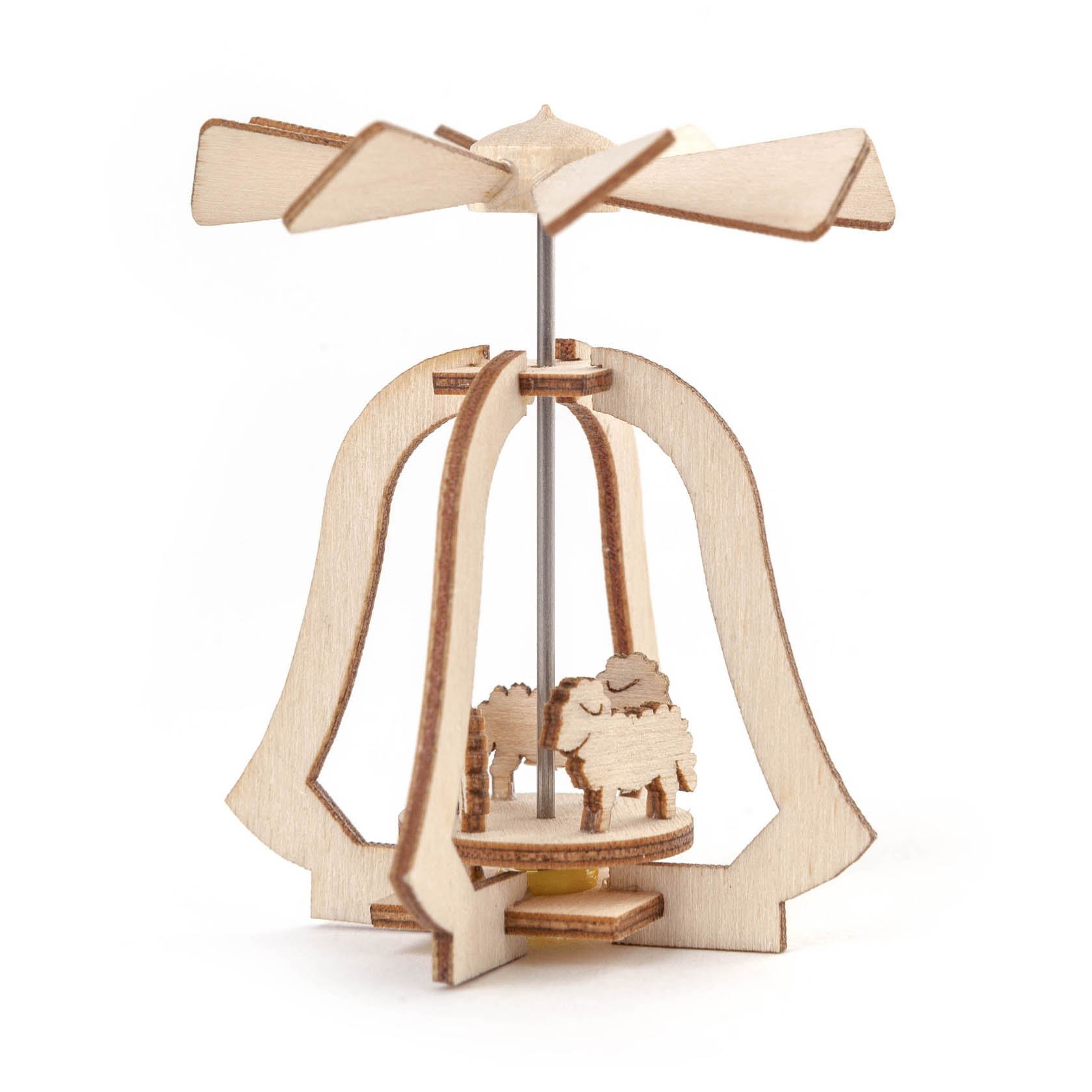 A small wooden heat toy featuring two carved sheep figures beneath a rotating propeller that spins when exposed to warmth.