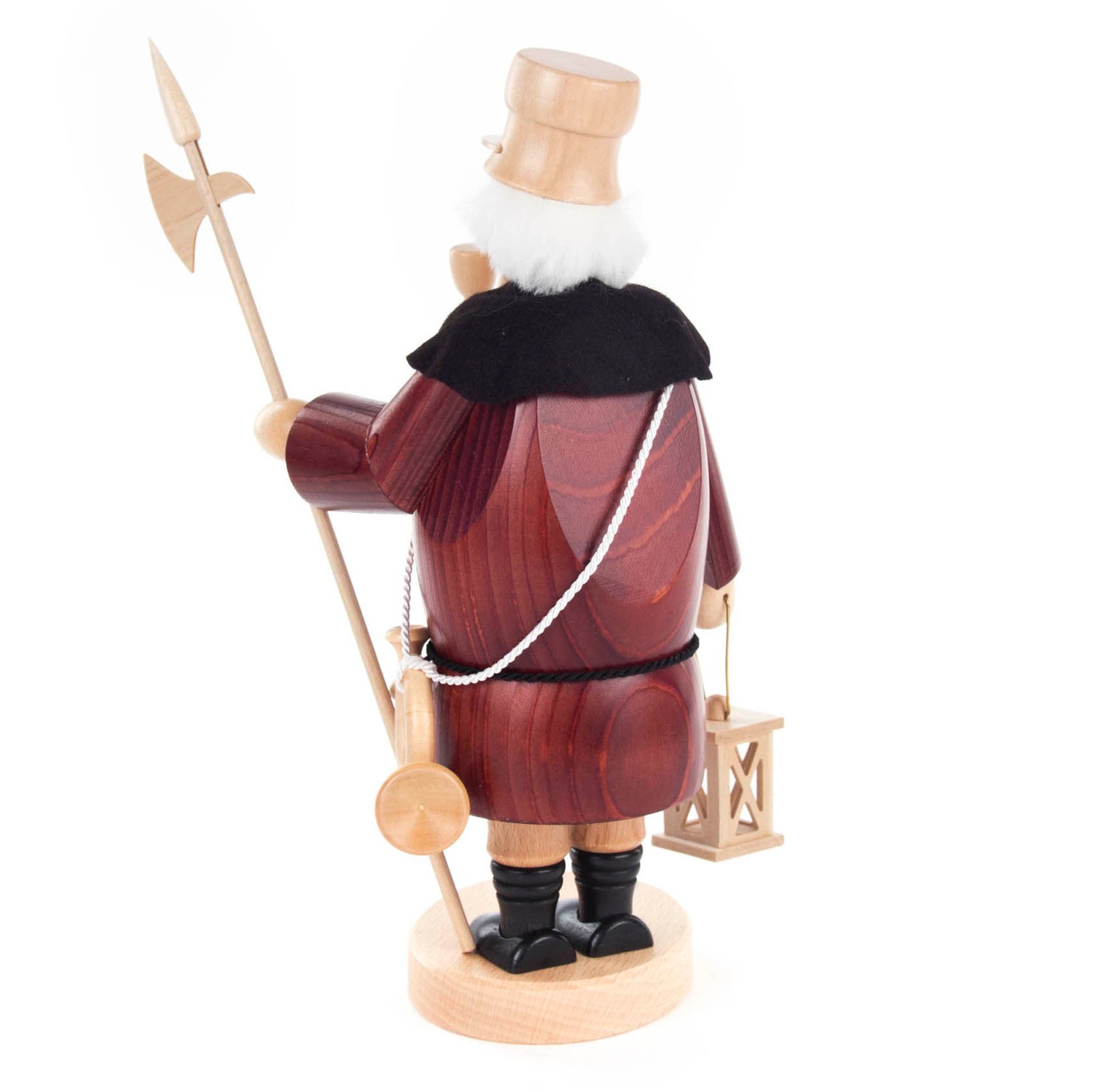 A traditional wooden smoking man figurine depicting a night watchman with a lantern and a halberd, wearing a cloak, hat, and boots.
