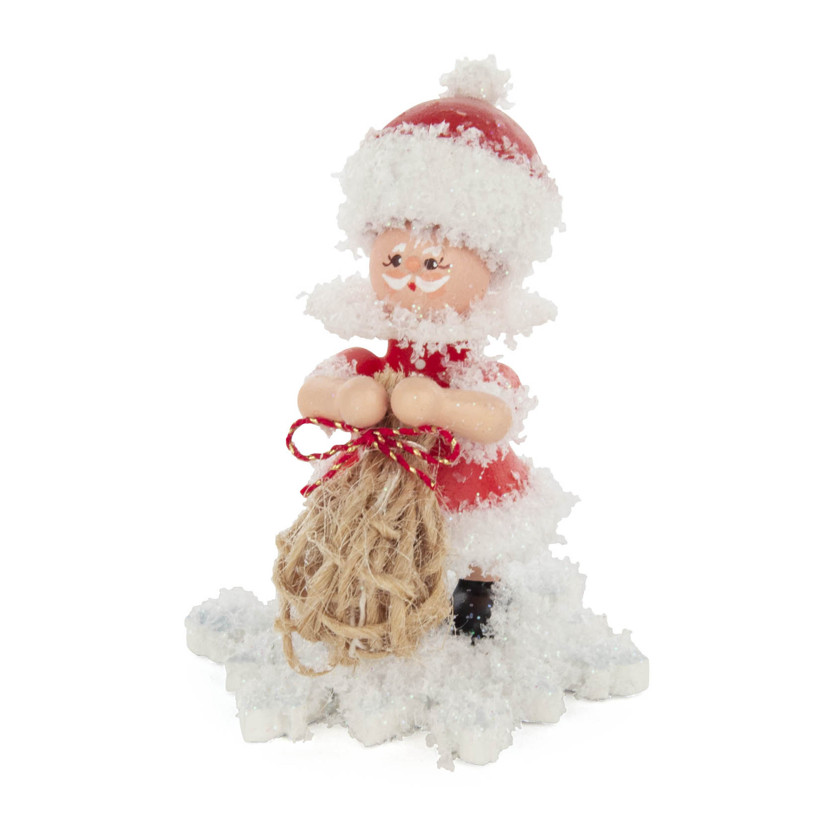A snowflake-themed figurine dressed as Santa Claus, holding a burlap sack, covered in artificial snow. im Dregeno Online Shop günstig kaufen