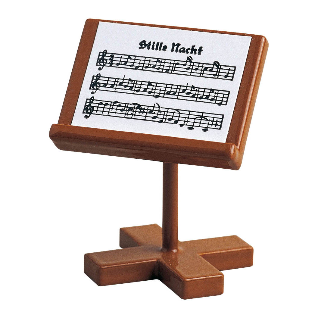 A small, brown music stand with sheet music titled 'Stille Nacht'.